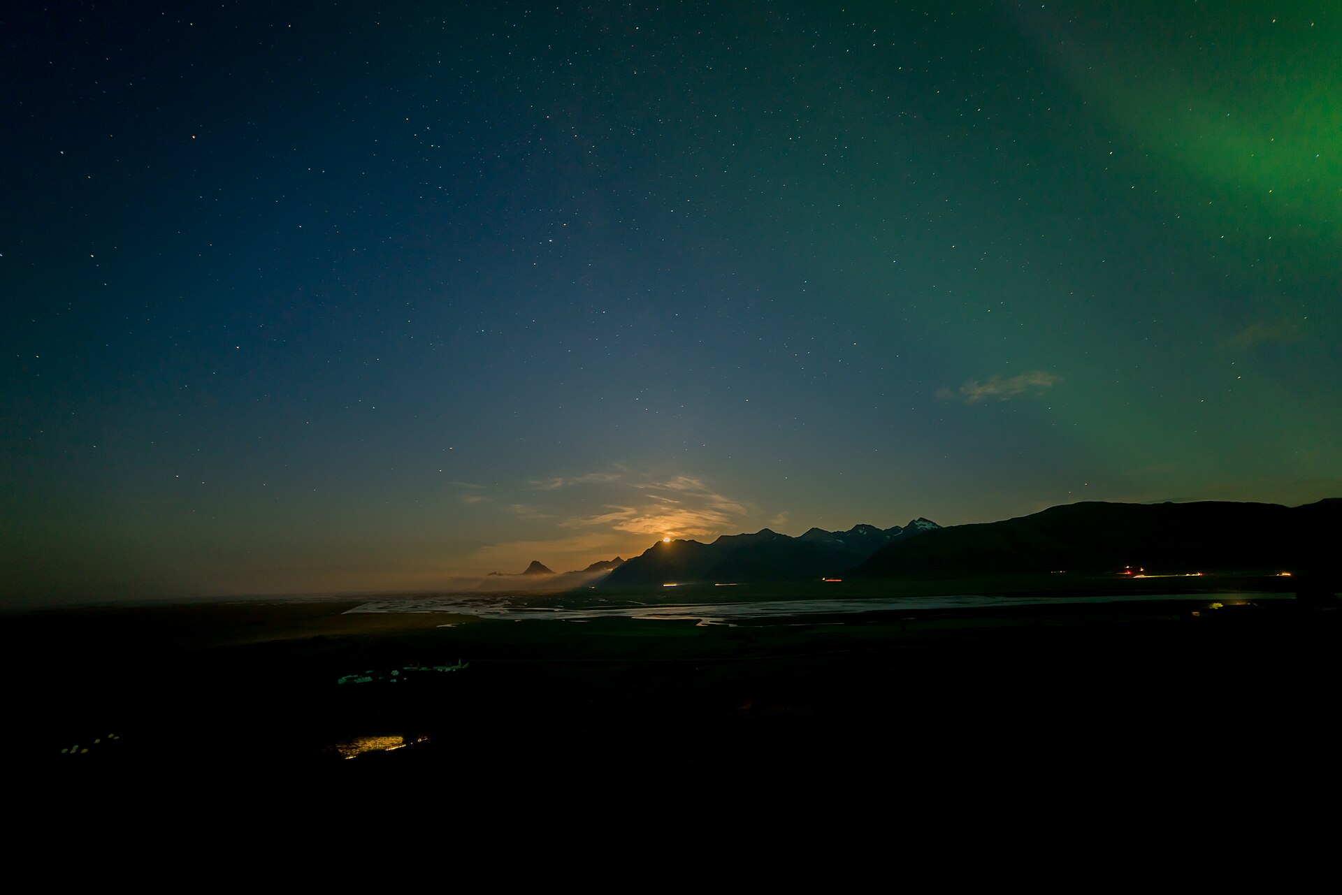 Aurora borealis above mountains in Iceland